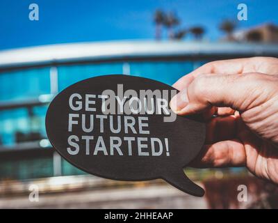 Get your future started. Man holds bubble quote. Stock Photo