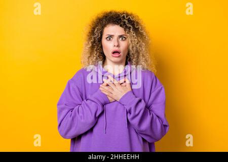 Photo of young impressed woman horrified face reaction trouble isolated over yellow color background Stock Photo