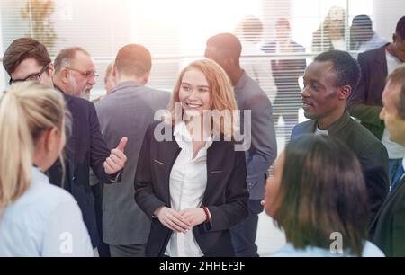 group of employees enthusiastically discussing new ideas . Stock Photo