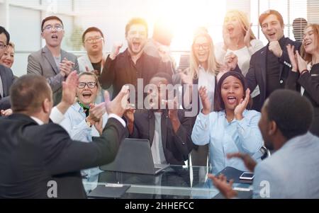 African American Businessman Boss With Group Of Business People In Creative Office, Successful Mix Race Man Leading Businesspeople Stock Photo