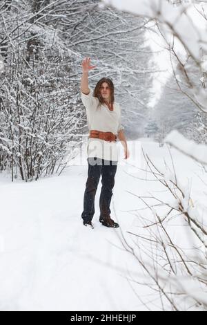 Outdoor portrait of handsome man in coat and scurf. Casual winter fashion Stock Photo