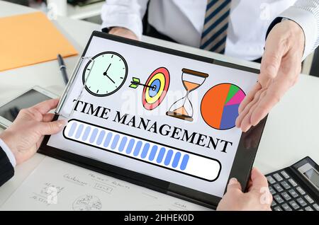 Time management concept shown by a businessman Stock Photo