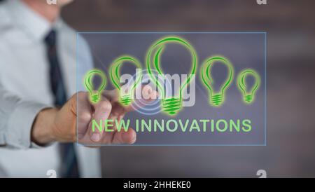Man touching a new innovations concept on a touch screen with his finger Stock Photo
