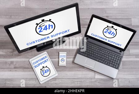 Customer support concept shown on different information technology devices Stock Photo