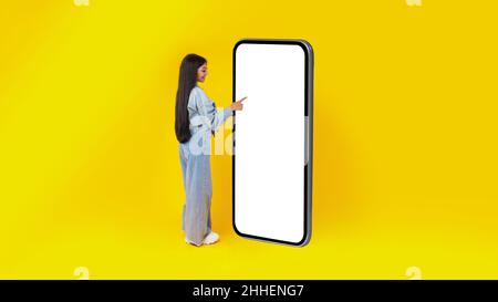 Woman using white empty smartphone screen panel Stock Photo