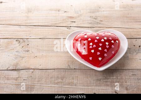 Heart shaped cake for Valentine's Day or mother's day on wooden table Stock Photo