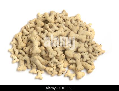 pile of heathy bone shaped dog and puppy biscuits treats  used for training and occasions on a white isolated background  macro shot Stock Photo