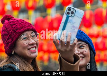 London, UK. 24th Jan, 2022. Final preparations as lanterns are put up in Chinatown - celebrations for Chinese New Year are once again going to be subdued this year due to the Omicron Variant of Covid 19. Thes will mark the start of the year of the tiger. Credit: Guy Bell/Alamy Live News Stock Photo