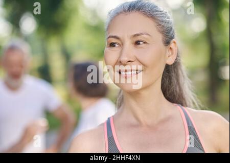 Close up of a smiling good-looking mid aged woman Stock Photo