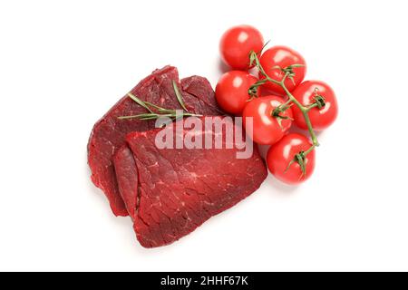 Raw beef steaks with tomatoes isolated on white background Stock Photo