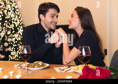 Romantic young man holding his beloved woman's hands Stock Photo