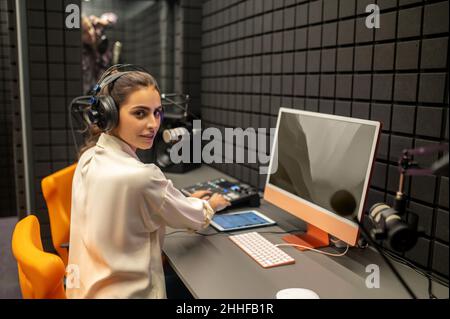 Professional working on the mixing console in the studio Stock Photo
