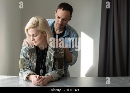 Husband Welcoming Wife Home On Army Leave Stock Photo