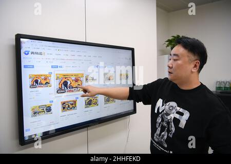 Guangzhou, China's Guangdong Province. 2nd Dec, 2021. A staff member shows an online toy exhibition hall in Chenghai District of Shantou City, south China's Guangdong Province, Dec. 2, 2021. Credit: Deng Hua/Xinhua/Alamy Live News Stock Photo