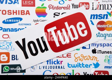 KIEV, UKRAINE - MARCH 10, 2017. YouTube, twitter, apple, pinterest logotype printed on paper. YouTube is a video-sharing website. Top view and mock up Stock Photo
