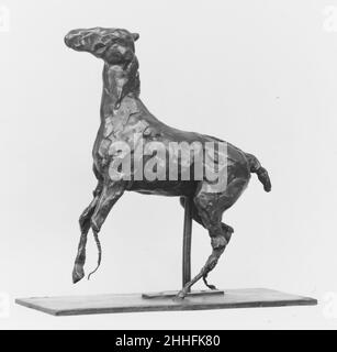 Prancing Horse modeled probably before 1885, cast 1920 Edgar Degas French Upon Degas's death in 1917, more than 150 figurative sculptures were found in his studio. Most were made of fragile wax, clay, and plastiline (a wax- and oil-based modeling material). Many had deteriorated. Only a few were preserved in copies that had been cast from them in plaster. Except for the wax Little Fourteen-Year-Old Dancer (Washington: NGA) none of these sculptures had been publicly exhibited during the artist’s lifetime.Although Degas had not favored reproducing his sculptures in more permanent materials, his Stock Photo