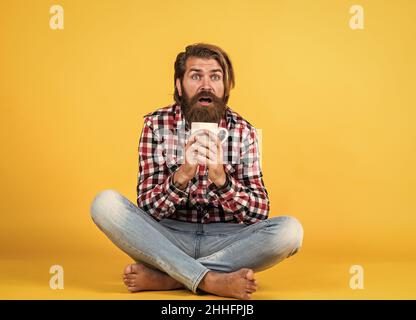 i like this. good morning to you. energetic warm beverage. need some coffee for inspiration. perfect start of the day. happy bearded man drinking Stock Photo