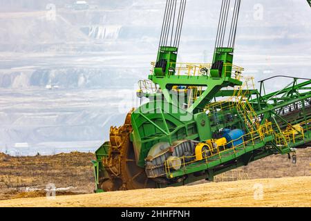 View of a giant excavator working on an opencast coal mine. Picture taken on a cloudy day, soft light. Stock Photo