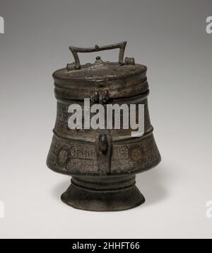 Container (Kuduo) 18th–19th century Akan peoples, Asante Ornate, cast brass vessels known as kuduo were the possessions of kings and courtiers in the Akan kingdoms. Gold dust and nuggets were kept in kuduo, as were other items of personal value and significance. As receptacles for their owners' kra, or life force, they were prominent features of ceremonies designed to honor and protect that individual. At the time of his death, a person's kuduo was filled with gold and other offerings and included in an assembly of items left at the burial site.The elaborate form and complex iconography of thi Stock Photo