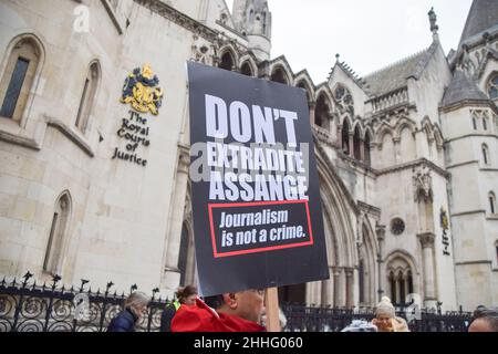 London, UK. 24th January 2022. Protesters gathered outside the Royal Courts of Justice in support of Julian Assange, as the WikiLeaks founder won the first stage in the appeal against his extradition to USA. Stock Photo