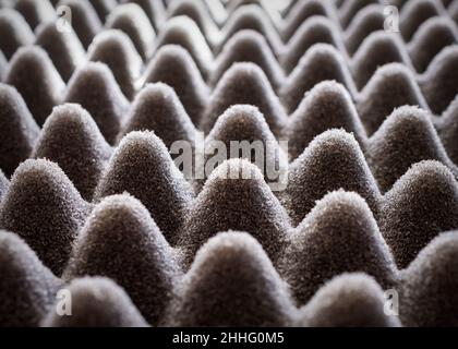 Light play on black egg crate foam.  Close up view. Stock Photo