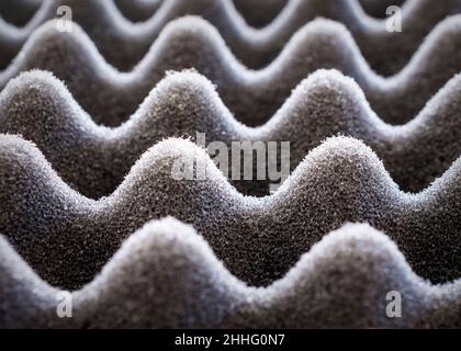 Light play on black egg crate foam.  Close up view. Stock Photo