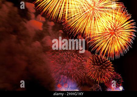 Fireworks display in the sky. 4th of July traditional close-up of fireworks exploding over the East River, New York City USA. Stock Photo