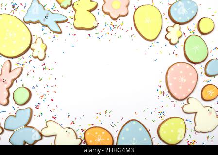 Gingerbread Cookies in shape of eggs and Easter bunny. Happy Easter holiday background concept. Stock Photo