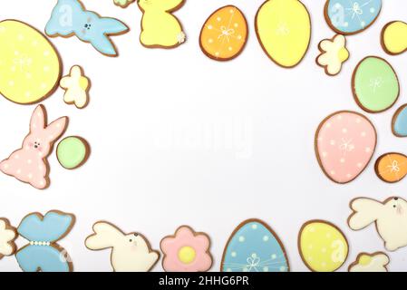 Gingerbread Cookies in shape of eggs and Easter bunny. Happy Easter holiday background concept. Stock Photo