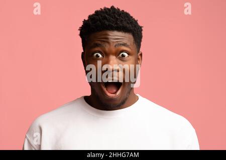 Amazed black guy looking at camera, closeup shot Stock Photo