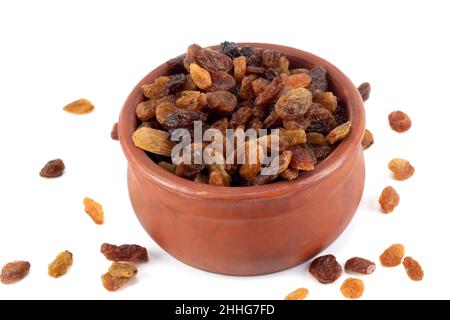 Sweet raisins or dried sweet grapes in a bowl isolated on a white background Stock Photo