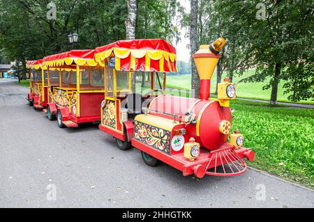 Veliky Novgorod, Russia - August 30, 2021: Cheerfully painted children's train for walks in the city park Stock Photo