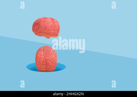 Minimal scene with a human brains falling into a hole in the floor. Abstract idea in concept of modern diagnostics and Artificial intelligence. Stock Photo
