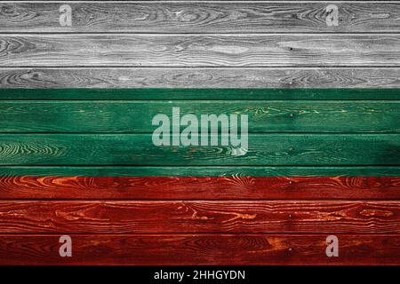 The national flag of Bulgaria is painted on a camp of even boards nailed with a nail. The symbol of the country. Stock Photo