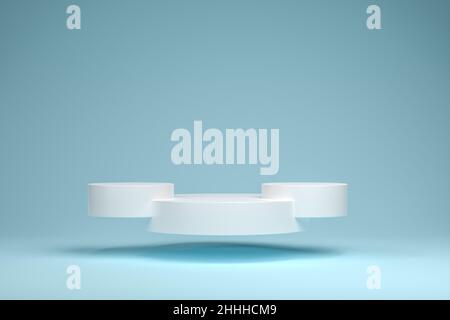 A hovering pedestal / podium in the form of three connected white cylinders in front of a blue green seamless background. Stock Photo