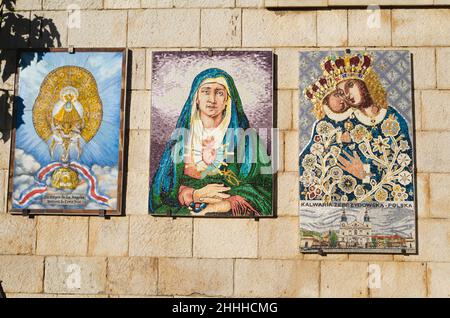 Nazareth, Israel - November 19 2019: Different icon mosaics of Madonna and the Child on the wall of the Basilica of Annunciation in Nazareth, Israel. Stock Photo