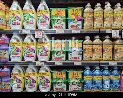 Ariel and Lenor products on supermarket sale. Store interior with plastic bottles of laundry detergent and fabric softener washing liquids on display. Stock Photo