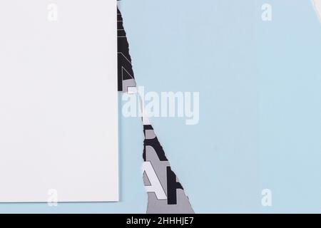 Torn paper textured collage background. Grunge ripped light blue paper pieces with ragged edge old poster background with letters Stock Photo