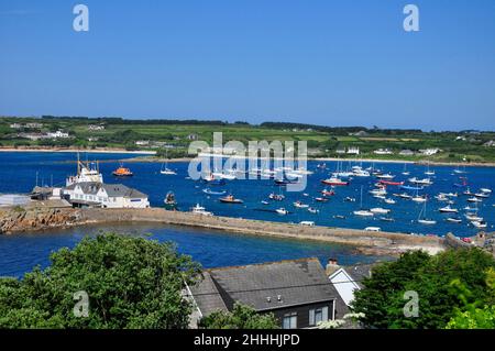 View from the top of Garrison Hill of the Quay with Scillonian III berthed across a full harbour on St Marys, Isles of Scilly.Cornwall, England Stock Photo