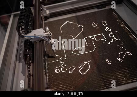 Machine for drawing and learning about dimensions and two-dimensional work.    Print3D itinerary exhibition about the numerous uses of 3D printing, in Stock Photo