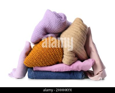 Stack of different stylish female clothes on white background Stock Photo