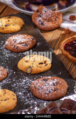 Cookies with chocolate, jam and coffee on a wooden table, flat lay, top view Stock Photo