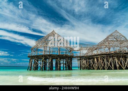 Indian Ocean coast. Wooden houses on stilts in the ebb and flow. Zanzibar, Tanzania Stock Photo