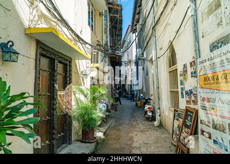 STONE TOWN, TANZANIA - December 22, 2021: Narrow streets and old houses in Stone town, Zanzibar, Tanzania Stock Photo