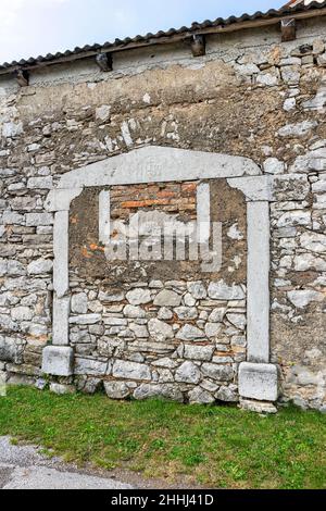 Traditional rustic entrance, big gates, in the Karst region in Slovenia is very typical for many Karst villages. Stock Photo