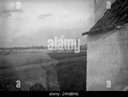 Shells bursting over the battlefield close to  Diksmuide during the Battle of  the Yser as Belgian soldiers move up to their trenches . Circa October 18th 1914 Stock Photo