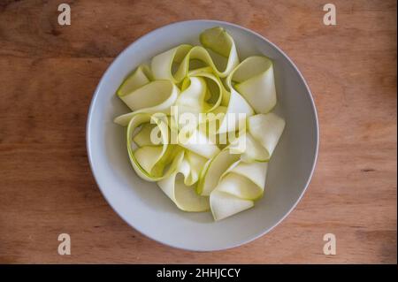 zucchini sliced slices sheets wood Stock Photo