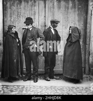 Peasants wearing national costume gather to hear election speeches in mid Dublin during the 1922 Irish General Election. 19th June 1922 Stock Photo