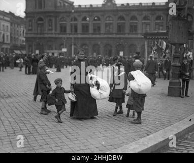 Refugees from the advancing German Army seen here  in Brussels. Circa 10th August 1914 Stock Photo