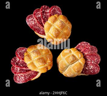 Milanese sandwich with salami on a black background. Italian food Stock Photo